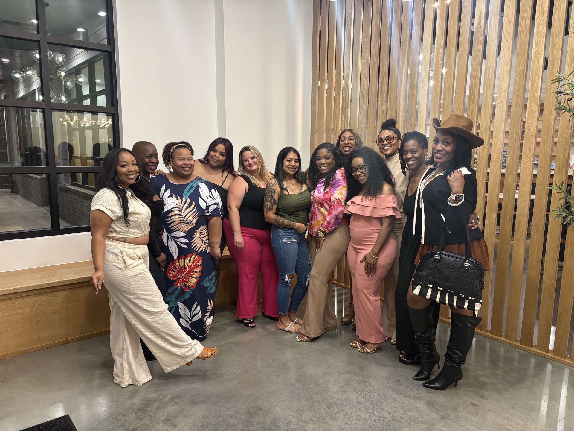 A full room of guests at an evening Ladies Collective event